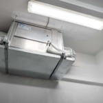 We used a split system cooling unit for this ultra-lavish wine cellar in Miami. The cooling duct is hidden behind a custom grille on the cellar's ceiling, while the air handle (in the picture) was installed in a separate room, away from the cellar.